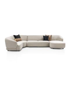 Designsofa Cervo in beige stof met afgeronde vormen en modulaire opstelling, schuin vooraanzicht.