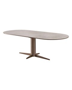 INHOUSE eettafel Nomira met plat ovaal Light Beton blad en bruine kolompoot.