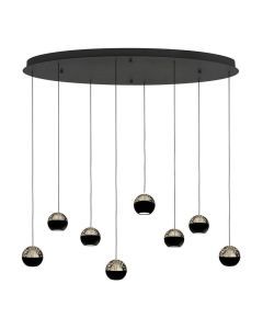 Hanglamp Belluno met acht smoke glazen bollen op verschillende hoogtes onder een zwarte ovale plafondplaat