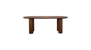 Dean eettafel van Dutchbone, volledig zijaanzicht met afgerond tafelblad en massieve houten poten met verticale groeven.