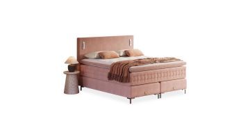 Boxspring Pure bed in roze uitvoering met luxe hoofdbord en comfortabele matrassen.