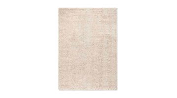 Vloerkleed Origin Low van zuivere scheerwol, rechthoekig kleed met rustige structuur en lichte naturel tint, gefotografeerd tegen een witte achtergrond.