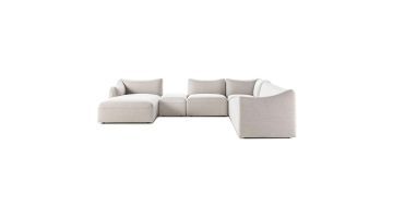 Pode Chablo modulaire hoekbank in lichte stof met chaise links, losse poef en hoekelement rechts op witte achtergrond.