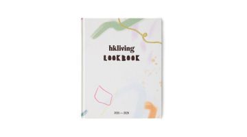 Voorkant van het HKLiving Lookbook 2025–2026 met kleurrijke abstracte illustraties op een witte achtergrond.