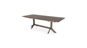 Uitschuiftafel Nexus met donker houten tafelblad en gecombineerd houten en metalen onderstel in moderne industriële stijl.
