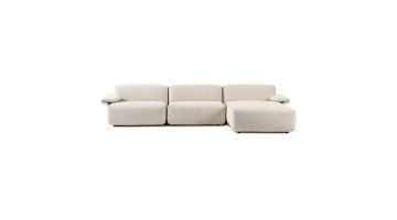 Crèmekleurige modulaire elementenbank Olen met chaise longue en zachte bouclé stof.