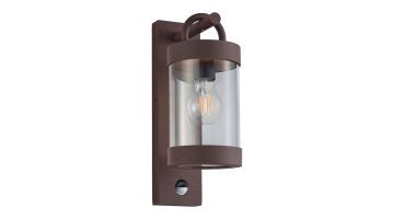 Roestkleurige Sambesi buitenwandlamp met bewegingssensor en cilindervormige glazen kap.