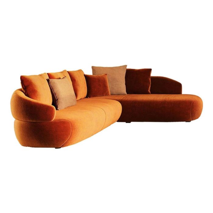 Organische hoekbank Astoria in warme oranje tint met afgeronde vormen en meerdere kussens