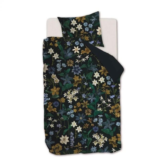 Dubbel dekbedovertrek Eve van Beddinghouse met bloemmotief in natuurtinten, gecombineerd met een effen donkerblauw kussensloop.
