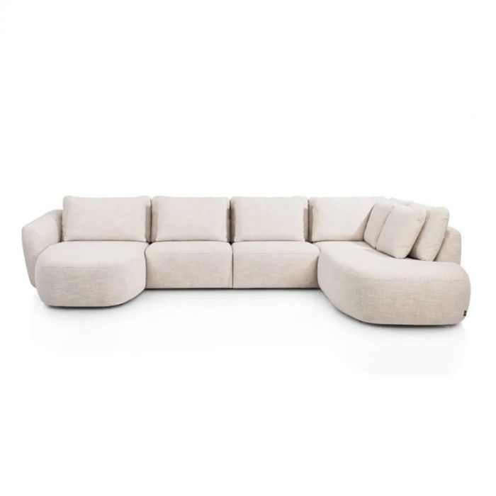 Henders & Hazel Bank Basento, grote modulaire hoekbank in beige stof met afgeronde vormen en losse rugkussens.