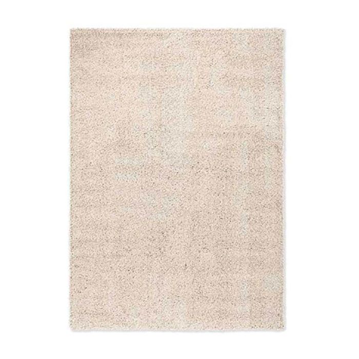 Vloerkleed Origin Low van zuivere scheerwol, rechthoekig kleed met rustige structuur en lichte naturel tint, gefotografeerd tegen een witte achtergrond.