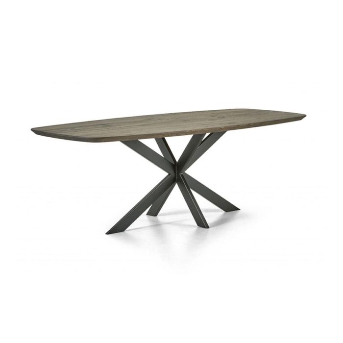 Montèl Ultimo eettafel in bruin met Deens ovaal massief eiken blad en zwart metalen kruispoot tegen lichte achtergrond