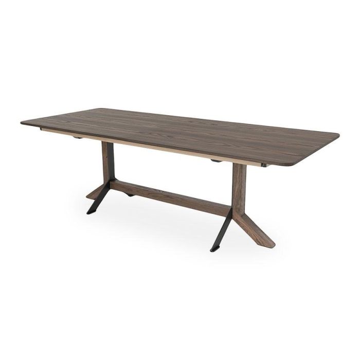 Uitschuiftafel Nexus met donker houten tafelblad en gecombineerd houten en metalen onderstel in moderne industriële stijl.