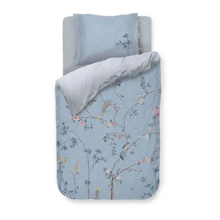 Pip Studio Bamboo Blossom dekbedovertrek met bloesemtakken, paradijsvogels en tegelprint op de achterzijde.