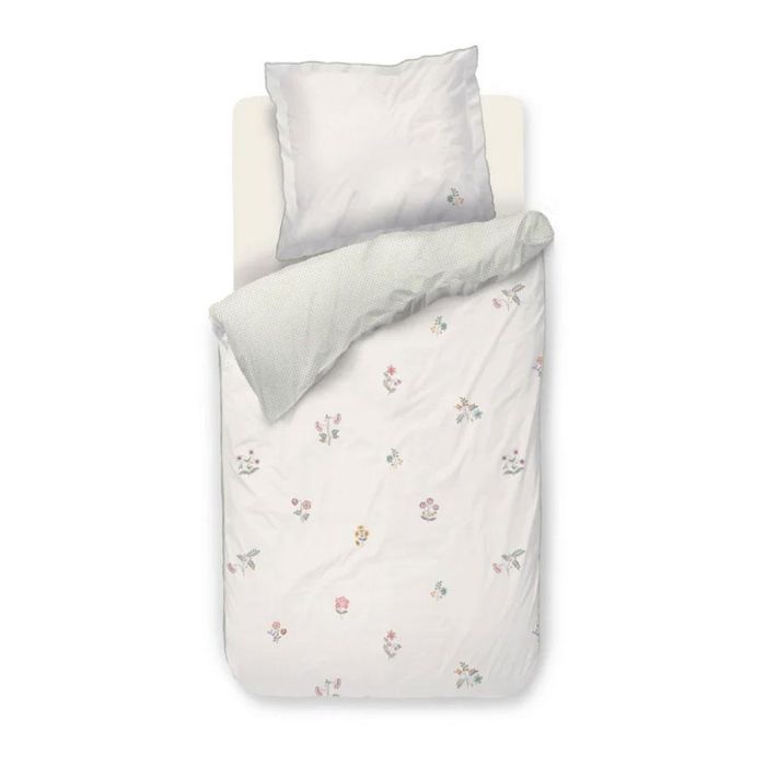 Pip Studio Mughal Flower dekbedovertrek offwhite met kleine bloemenboeketjes en sterrenprint aan de achterzijde.